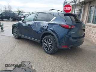 2018 Mazda CX-5 Grand Touring with VIN JM3KFADM1J1439544, listed as a IAAI auction lot 41891134 with 54,132 mi miles and . Bid and sale history available at DreamBid. Image 3.