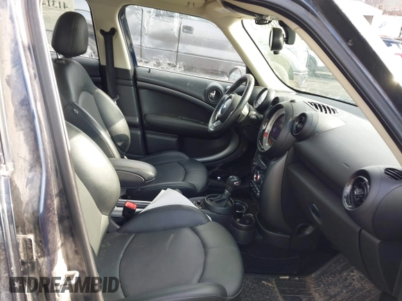 2013 MINI Countryman S ALL4 with VIN WMWZC5C58DWP30936, listed as a IAAI auction lot 41314553 with 128,405 mi miles and . Bid and sale history available at DreamBid. Image 5.