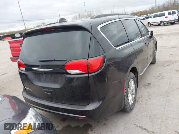 2017 Chrysler Pacifica Touring L with VIN 2C4RC1BG1HR797200, listed as a IAAI auction lot 42044020 with 124,115 mi miles and . Bid and sale history available at DreamBid. Image 16.