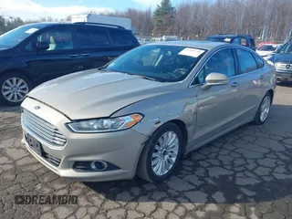 2015 Ford Fusion SE Hybrid with VIN 3FA6P0LUXFR133979, listed as a IAAI auction lot 41831288 with 143,738 mi miles. Bid and sale history available at carsss.com. Image 2.