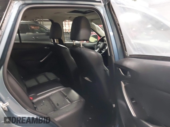 2016 Mazda CX-5 Grand Touring z VIN JM3KE4DY9G0714468, wystawiony jako IAAI lot #41860956 z przebiegiem 114 481 mil mil oraz . Historia ofert i sprzedaży dostępna na DreamBid. Obrazek 8.