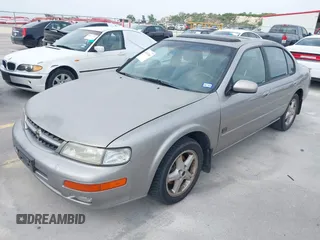 1999 Nissan Maxima GXE with VIN JN1CA21D6XT223369, listed as a IAAI auction lot 42141361 with 210,781 mi miles and . Bid and sale history available at DreamBid. Image 2.