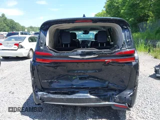 2023 Chrysler Pacifica Touring L with VIN 2C4RC1BG2PR534194, listed as a IAAI auction lot 42613934 with 69,896 mi miles and . Bid and sale history available at DreamBid. Image 16.