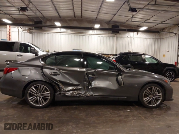2014 Infiniti Q50 Premium with VIN JN1BV7ARXEM699902, listed as a IAAI auction lot 42135410 with 103,929 mi miles and . Bid and sale history available at DreamBid. Image 14.