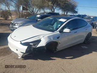 2021 Tesla Model 3 Performance with VIN 5YJ3E1EC6MF926448, listed as a IAAI auction lot 41240309 with 39,386 mi miles and . Bid and sale history available at DreamBid. Image 2.
