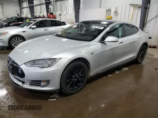 2014 Tesla Model S 60 with VIN 5YJSA1H15EFP51239, listed as a Copart auction lot 59214485 with 153,554 mi miles and Salvage title. Bid and sale history available at DreamBid. Image 1.