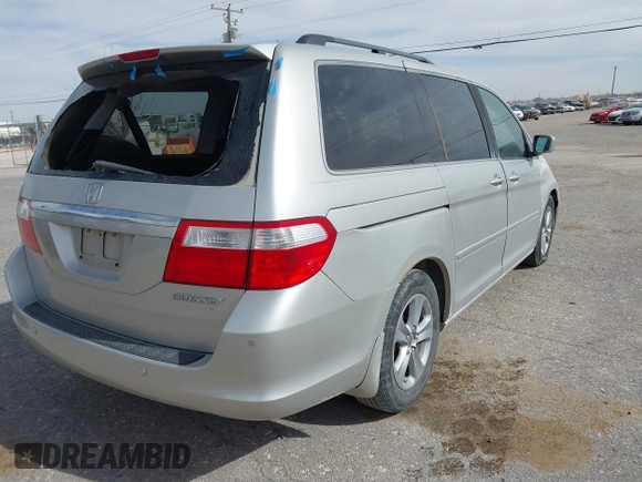 2005 Honda Odyssey TOURING with VIN 5FNRL38895B060605, listed as a IAAI auction lot 41809330 with 228,487 mi miles. Bid and sale history available at carsss.com. Image 4.
