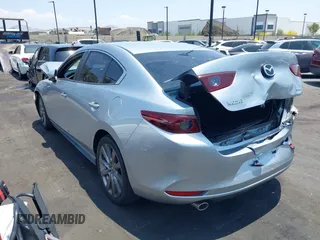 2020 Mazda 3 Select with VIN 3MZBPACL1LM131999, listed as a IAAI auction lot 42433532 with 23,067 mi miles and . Bid and sale history available at DreamBid. Image 3.