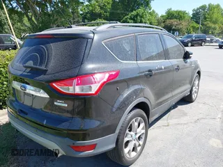2013 Ford Escape SEL with VIN 1FMCU0HX8DUB38480, listed as a IAAI auction lot 42176271 with 154,309 mi miles. Bid and sale history available at carsss.com. Image 4.