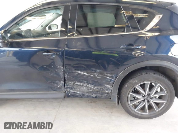 2018 Mazda CX-5 Grand Touring with VIN JM3KFBDM4J0302870, listed as a IAAI auction lot 41934217 with 57,151 mi miles. Bid and sale history available at carsss.com. Image 6.