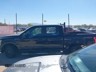 2015 Ford F-150 XLT with VIN 1FTEW1C89FKE65742, listed as a IAAI auction lot 42117957 with 153,413 mi miles and . Bid and sale history available at carsss.com. Image 14.