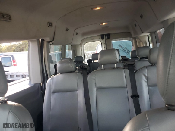 2016 Ford Transit Wagon XL with VIN 1FBZX2CM5GKA21099, listed as a Copart auction lot 77084614 with 128,446 mi miles and Salvage Title. Bid and sale history available at carsss.com. Image 10.