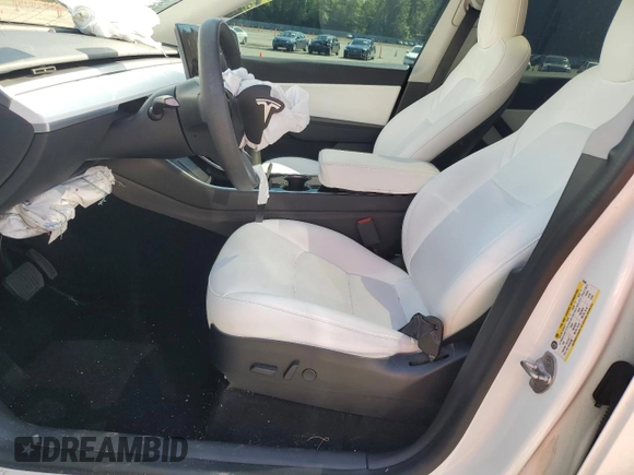 2020 Tesla Model Y Long Range with VIN 5YJYGDEF9LF023060, listed as a Copart auction lot 55462395 with 58,211 mi miles and Salvage Title. Bid and sale history available at DreamBid. Image 7.