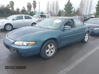 1997 Pontiac Grand Prix SE with VIN 1G2WJ52K0VF249961, listed as a IAAI auction lot 41512770 with 168,408 mi miles. Bid and sale history available at carsss.com. Image 2.