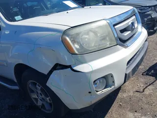 2011 Honda Pilot Touring with VIN 5FNYF4H97BB067954, listed as a IAAI auction lot 41832617 with 141,141 mi miles. Bid and sale history available at carsss.com. Image 6.