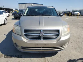 2009 Dodge Caliber SXT z VIN 1B3HB48A19D199410, wystawiony jako Copart lot #55133965 z przebiegiem 141 658 mil mil oraz Szkoda całkowita • Salvage title. Historia ofert i sprzedaży dostępna na DreamBid. Obrazek 5.