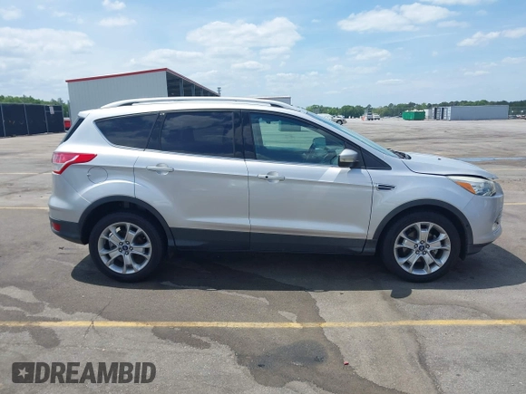 2014 Ford Escape Titanium with VIN 1FMCU0JX7EUA28824, listed as a IAAI auction lot 42065325 with 107,761 mi miles. Bid and sale history available at carsss.com. Image 13.