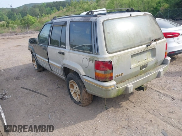 1994 Jeep Grand Cherokee Laredo z VIN 1J4GZ58Y1RC265589, wystawiony jako IAAI lot #42142226 z przebiegiem 138 656 mil mil oraz . Historia ofert i sprzedaży dostępna na DreamBid. Obrazek 3.