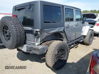2015 Jeep Wrangler Unlimited Sahara with VIN 1C4BJWEG2FL558860, listed as a IAAI auction lot 41937360 with 113,627 mi miles. Bid and sale history available at carsss.com. Image 4.