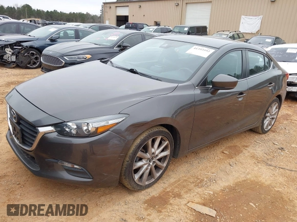 2017 Mazda 3 Touring z VIN JM1BN1V77H1101001, wystawiony jako IAAI lot #41393592 z przebiegiem 77 566 mil mil oraz . Historia ofert i sprzedaży dostępna na DreamBid. Obrazek 2.