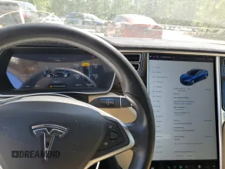 2014 Tesla Model S 60 with VIN 5YJSA1H10EFP52850, listed as a Copart auction lot 54321805 with 58,031 mi miles and Salvage Title. Bid and sale history available at DreamBid. Image 9.