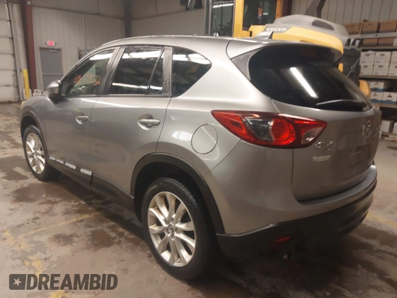 2014 Mazda CX-5 Grand Touring with VIN JM3KE4DY5E0305882, listed as a IAAI auction lot 41879532 with 173,443 mi miles. Bid and sale history available at carsss.com. Image 3.