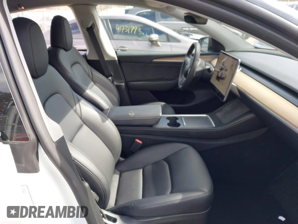 2023 Tesla Model Y Long Range with VIN 7SAYGDEE7PF832007, listed as a IAAI auction lot 41751598 with 14,126 mi miles and . Bid and sale history available at DreamBid. Image 5.