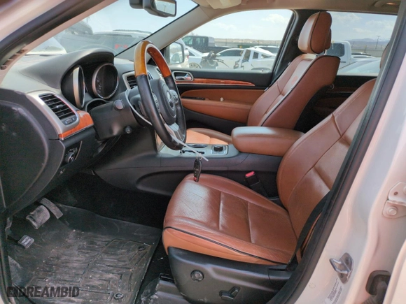 2012 Jeep Grand Cherokee Overland with VIN 1C4RJFCG9CC199486, listed as a Copart auction lot 51942135 with 113,098 mi miles and Salvage Title. Bid and sale history available at carsss.com. Image 7.