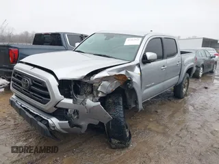 2018 Toyota Tacoma SR with VIN 3TMCZ5AN4JM148581, listed as a IAAI auction lot 41462945 with 115,655 mi miles. Bid and sale history available at carsss.com. Image 2.