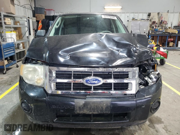 2011 Ford Escape XLS z VIN 1FMCU9C77BKC43662, wystawiony jako Copart lot #51779335 z przebiegiem 104 548 mil mil oraz Szkoda całkowita • Salvage title. Historia ofert i sprzedaży dostępna na DreamBid. Obrazek 5.
