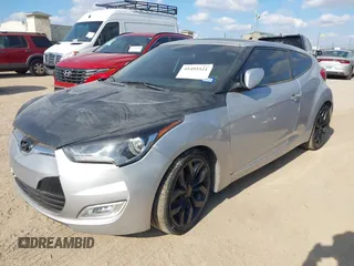 2012 Hyundai Veloster w/Gray Int with VIN KMHTC6AD0CU068400, listed as a IAAI auction lot 41493521 with 72,682 mi miles and . Bid and sale history available at DreamBid. Image 2.