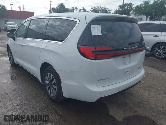 2023 Chrysler Pacifica Hybrid Touring L z VIN 2C4RC1L74PR541551, wystawiony jako IAAI lot #42028927 z przebiegiem 57 772 mil mil oraz . Historia ofert i sprzedaży dostępna na DreamBid. Obrazek 3.