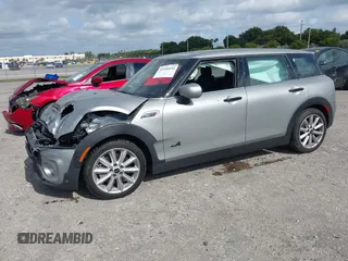 2023 MINI Clubman Cooper S with VIN WMWXJ1C03P2U08484, listed as a IAAI auction lot 41056651 with 12,948 mi miles. Bid and sale history available at carsss.com. Image 2.