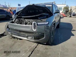 2025 Rivian R1S Adventure z VIN 7PDSGBBA5SN048839, wystawiony jako Copart lot #89199375 z przebiegiem 5177 mil mil oraz Szkody całkowita. Historia ofert i sprzedaży dostępna na DreamBid. Obrazek 11.