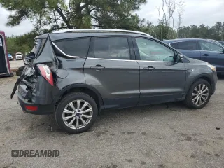 2017 Ford Escape Titanium with VIN 1FMCU0J98HUF09588, listed as a Copart auction lot 48988765 with 101,887 mi miles and Salvage Title. Bid and sale history available at DreamBid. Image 3.