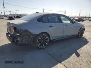 2024 BMW 5 Series 530i with VIN WBA43FJ06RCP67824, listed as a Copart auction lot 61351965 with 12,990 mi miles and Salvage title. Bid and sale history available at DreamBid. Image 3.