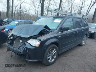 2014 Dodge Grand Caravan SXT with VIN 2C4RDGCG8ER257837, listed as a IAAI auction lot 41211629 with 139,231 mi miles and . Bid and sale history available at DreamBid. Image 18.