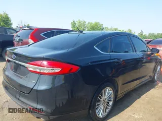 2017 Ford Fusion SE z VIN 3FA6P0H71HR135111, wystawiony jako IAAI lot #42454080 z przebiegiem 120 355 mil mil oraz . Historia ofert i sprzedaży dostępna na DreamBid. Obrazek 4.