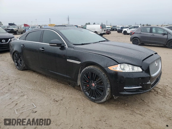2014 Jaguar XJ Portfolio z VIN SAJWA2GZ2E8V64993, wystawiony jako Copart lot #88774965 z przebiegiem Nie podano mil oraz Szkoda całkowita • Salvage title. Historia ofert i sprzedaży dostępna na DreamBid. Obrazek 4.