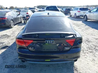 2013 Audi A7 3.0 Prestige with VIN WAU2GAFC2DN065112, listed as a IAAI auction lot 41117426 with 159,105 mi miles. Bid and sale history available at carsss.com. Image 17.