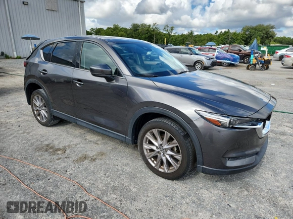 2019 Mazda CX-5 Grand Touring with VIN JM3KFADM2K1637664, listed as a Copart auction lot 63400975 with 45,663 mi miles and Salvage title. Bid and sale history available at DreamBid. Image 4.