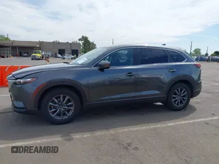 2021 Mazda CX-9 Sport with VIN JM3TCBBY7M0520437, listed as a IAAI auction lot 42022562 with 77,063 mi miles and . Bid and sale history available at DreamBid. Image 14.