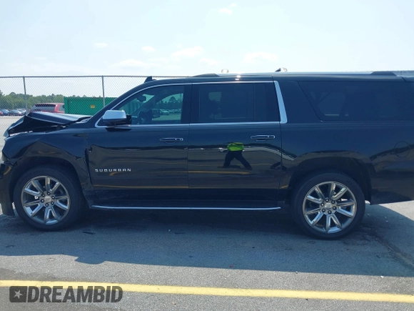 2019 Chevrolet Suburban LT with VIN 1GNSCJKC5KR304766, listed as a IAAI auction lot 42410264 with 105,171 mi miles and . Bid and sale history available at DreamBid. Image 14.