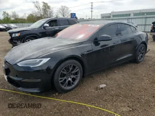 2021 Tesla Model S Plaid с VIN 5YJSA1E6XMF456295, выставлен на аукционе Copart как лот 55877025 с пробегом Не указан миль и Списание • Salvage title. История ставок и продаж доступна на DreamBid. Изображение 1.