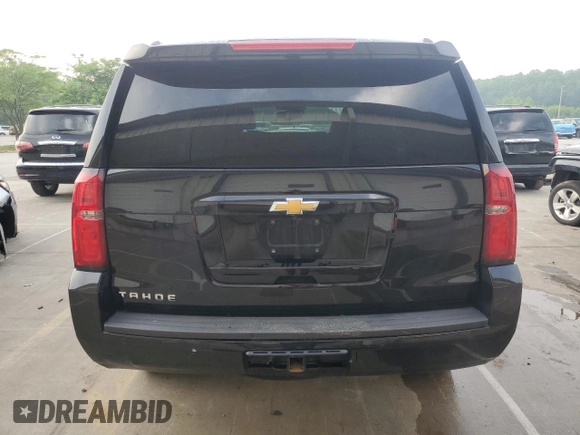 2019 Chevrolet Tahoe LT with VIN 1GNSKBKC2KR349527, listed as a Copart auction lot 58496695 with 128,590 mi miles and Salvage title. Bid and sale history available at DreamBid. Image 6.
