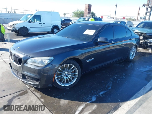 2015 BMW 7 Series 750Li with VIN WBAYE8C52FD780902, listed as a IAAI auction lot 40808265 with 102,774 mi miles. Bid and sale history available at carsss.com. Image 2.