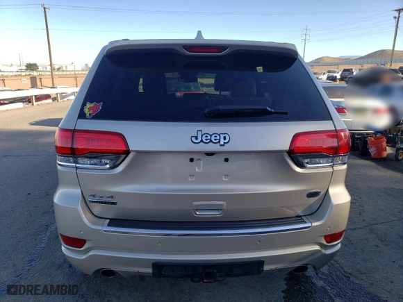 2014 Jeep Grand Cherokee Overland with VIN 1C4RJFCM2EC556953, listed as a Copart auction lot 73046974 with 106,889 mi miles and Salvage Title. Bid and sale history available at carsss.com. Image 6.