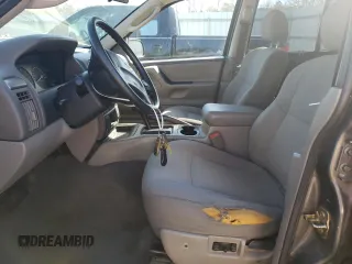 2004 Jeep Grand Cherokee Laredo z VIN 1J4GX48N14C435481, wystawiony jako Copart lot #87855975 z przebiegiem 176 273 mil mil oraz Szkoda całkowita • Salvage title. Historia ofert i sprzedaży dostępna na DreamBid. Obrazek 7.