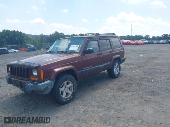 2000 Jeep Cherokee z VIN 1J4FF48S1YL256206, wystawiony jako IAAI lot #42835740 z przebiegiem 131 864 mil mil oraz . Historia ofert i sprzedaży dostępna na DreamBid. Obrazek 2.