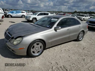 2003 Mercedes-Benz E-Class 5.0L with VIN WDBUF70J73A119596, listed as a Copart auction lot 77382424 with 237,620 mi miles and Salvage Title. Bid and sale history available at carsss.com. Image 1.